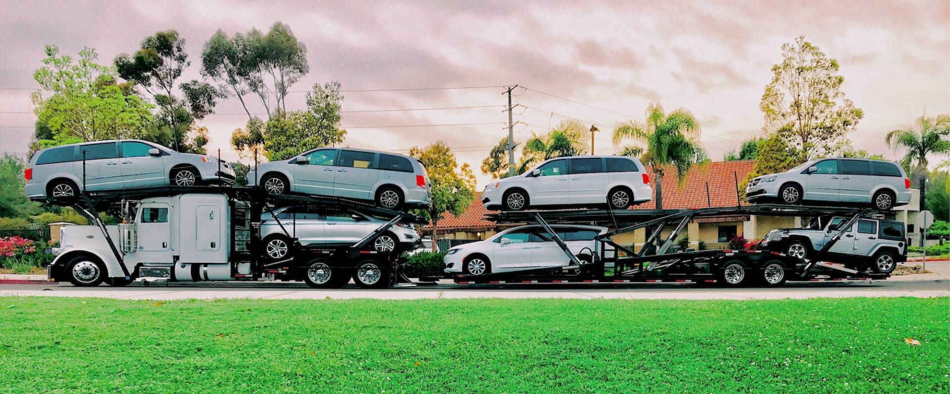 NOMINATED Car carrier auto transport truck filled with cars ready for a cross country road trip